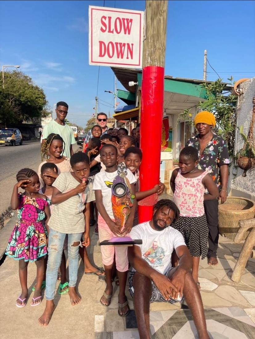 Community engagement with local youth in a Ghanaian town, featuring upcycled art