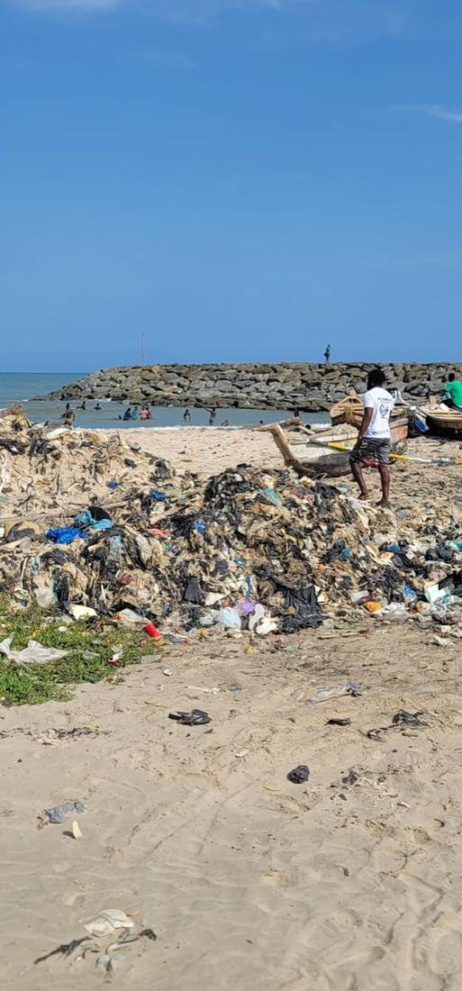 Coastal plastic waste accumulation near a jetty in Ghana